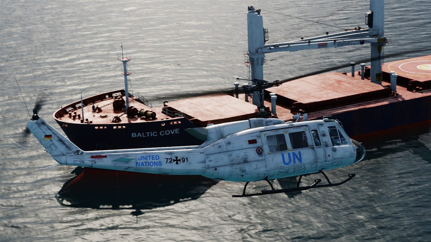 UN Huey approaching a cargo ship
